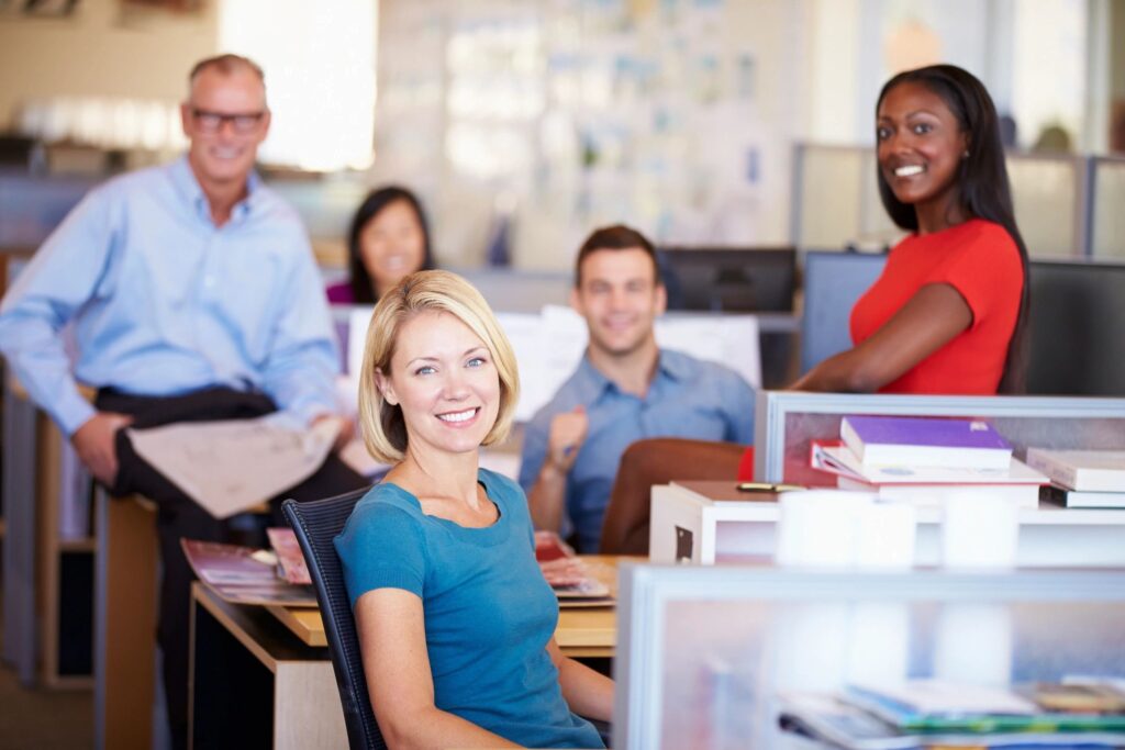 A group of people posing for a picture at an office