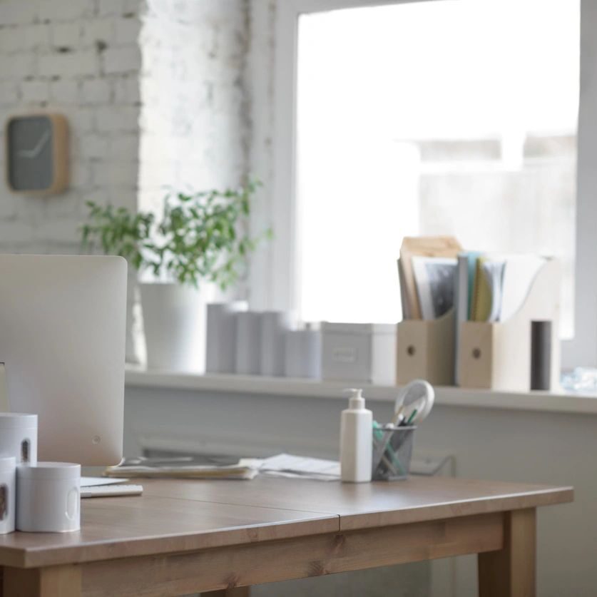 A picture of an office desk with a computer monitor